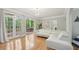 Bright living room with hardwood floors, fireplace, and access to the outdoor space at 3780 Bays Ferry Way, Marietta, GA 30062