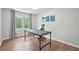 Well-lit office space with wood floors, a large window, and a modern desk at 3780 Bays Ferry Way, Marietta, GA 30062