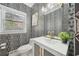 Powder room boasts patterned wallpaper, updated fixtures and vanity with undermount sink at 3780 Bays Ferry Way, Marietta, GA 30062
