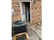 Enclosed patio with brick walls, AC unit and entrance to kitchen at 4701 Flat Shoals Rd # 65A, Union City, GA 30291