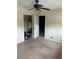 Cozy bedroom with plush carpeting and a ceiling fan for added comfort at 4701 Flat Shoals Rd # 65A, Union City, GA 30291