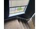 Carpeted staircase offering natural light and access to the upper level at 4701 Flat Shoals Rd # 65A, Union City, GA 30291