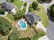 Stunning aerial view of a home with a backyard pool, patio, and lush landscaping in a suburban neighborhood at 503 Chatfield Nw Way, Marietta, GA 30064