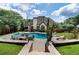 Scenic backyard with an in-ground pool, stone fire pit, mature trees, and lots of space for entertaining at 503 Chatfield Nw Way, Marietta, GA 30064