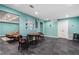 Basement area with slate tile flooring, table with chairs, and an open doorway to another room at 503 Chatfield Nw Way, Marietta, GA 30064