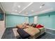 Finished basement Gathering room has large sectional sofa, stacked stone, and recessed lighting at 503 Chatfield Nw Way, Marietta, GA 30064