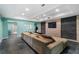 Finished basement living room with slate tile floors and stacked stone accent walls at 503 Chatfield Nw Way, Marietta, GA 30064