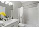 Neutral bathroom with white tiled shower and bathtub combination at 503 Chatfield Nw Way, Marietta, GA 30064