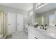 Bathroom offers double vanity, large mirrors, and a glass shower enclosure at 503 Chatfield Nw Way, Marietta, GA 30064