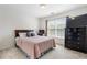 Cozy bedroom features carpet, a double bed, a dresser, and a window with blinds at 503 Chatfield Nw Way, Marietta, GA 30064