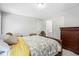 Comfortable bedroom with carpet, a queen bed, a dresser, and access to a bathroom at 503 Chatfield Nw Way, Marietta, GA 30064