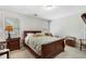 Cozy bedroom featuring two windows, a queen bed, two bedside tables, and carpet at 503 Chatfield Nw Way, Marietta, GA 30064