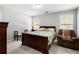 Comfortable bedroom with carpet, natural light, and light-colored walls and dark trim at 503 Chatfield Nw Way, Marietta, GA 30064