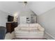 Bright bonus room features vaulted ceilings, carpet, television, sleeper sofa, and storage at 503 Chatfield Nw Way, Marietta, GA 30064