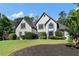 Elegant two-story home with manicured lawn and mulched garden bed at 503 Chatfield Nw Way, Marietta, GA 30064