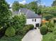 A charming home exterior featuring a driveway and manicured landscaping at 503 Chatfield Nw Way, Marietta, GA 30064