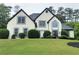 Charming two-story home with a manicured lawn, symmetrical windows and black shingle roof at 503 Chatfield Nw Way, Marietta, GA 30064