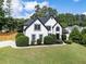 Charming home with lush landscaping, a well-maintained lawn, and a welcoming facade at 503 Chatfield Nw Way, Marietta, GA 30064
