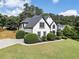 Gorgeous home with lush landscaping and a large, well-manicured front lawn at 503 Chatfield Nw Way, Marietta, GA 30064