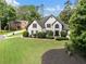 Beautiful two-story home with a lush green lawn and decorative shrubbery at 503 Chatfield Nw Way, Marietta, GA 30064