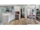 Modern kitchen with stainless steel appliances and adjacent living room view with fireplace at 503 Chatfield Nw Way, Marietta, GA 30064