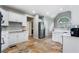 Bright kitchen features white cabinets, stainless steel appliances, and tile floors at 503 Chatfield Nw Way, Marietta, GA 30064