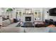 Bright living room with a fireplace, hardwood floors, access to the backyard pool, and comfortable seating at 503 Chatfield Nw Way, Marietta, GA 30064