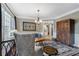 Cozy living room showcasing a bay window, stylish furnishings, and an open view to the adjacent kitchen at 503 Chatfield Nw Way, Marietta, GA 30064