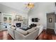 Spacious living room featuring a vaulted ceiling, fireplace, hardwood floors, and access to the backyard pool at 503 Chatfield Nw Way, Marietta, GA 30064