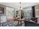 Cozy living room showcasing a bay window, stylish furnishings, and an open view to the adjacent kitchen at 503 Chatfield Nw Way, Marietta, GA 30064