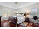 Spacious bedroom with hardwood floors, ceiling fan, and natural light at 503 Chatfield Nw Way, Marietta, GA 30064