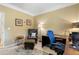 Neutral home office features desk, chair, lamps and area rug at 503 Chatfield Nw Way, Marietta, GA 30064