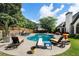 Beautiful backyard with pool, tanning chairs, built-in grill, and lounge area, perfect for relaxing and entertaining at 503 Chatfield Nw Way, Marietta, GA 30064