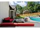 Backyard with a pool, patio furniture, and a lush lawn with mature trees at 503 Chatfield Nw Way, Marietta, GA 30064