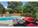 Backyard with a large swimming pool, surrounding patio, and a well-manicured lawn at 503 Chatfield Nw Way, Marietta, GA 30064