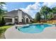 Backyard features a swimming pool, patio area with furniture, and well-maintained lawn at 503 Chatfield Nw Way, Marietta, GA 30064