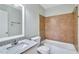 Bathroom features a tiled shower-tub combo and sleek vanity with a white countertop at 3137 Buford Ne Hwy # 11, Brookhaven, GA 30329