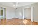 Bright bedroom featuring hardwood floors, ample closet space, and an open door at 3137 Buford Ne Hwy # 11, Brookhaven, GA 30329