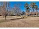 Community firepit with yellow Adirondack chairs invites relaxation and socializing in a grassy open space at 3137 Buford Ne Hwy # 11, Brookhaven, GA 30329