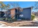 Charming exterior view with a blue brick facade, wood accent, and black iron staircases at 3137 Buford Ne Hwy # 11, Brookhaven, GA 30329