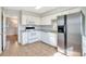 Bright kitchen with stainless steel appliances, white cabinetry, and tiled floor at 3137 Buford Ne Hwy # 11, Brookhaven, GA 30329