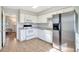 Well-equipped kitchen with stainless steel appliances, white cabinetry and tile flooring at 3137 Buford Ne Hwy # 11, Brookhaven, GA 30329