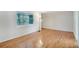 Bright and airy living room featuring gleaming hardwood floors and a large window at 3137 Buford Ne Hwy # 11, Brookhaven, GA 30329