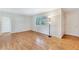 Bright living room featuring gleaming hardwood floors, large windows, and neutral paint at 3137 Buford Ne Hwy # 11, Brookhaven, GA 30329