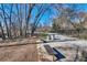 Park benches provide a relaxing spot along the creek, with trash receptacles and an ornamental fence nearby at 3137 Buford Ne Hwy # 11, Brookhaven, GA 30329