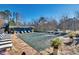 The fenced community pool is surrounded by plenty of lounge chairs and potted plants for relaxing by the water at 3137 Buford Ne Hwy # 11, Brookhaven, GA 30329