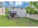 A large backyard featuring a deck, grass, and privacy fence at 5290 Forest Downs Ln, Atlanta, GA 30349