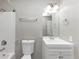 Clean bathroom with a white vanity, toilet, and shower with modern fixtures at 5290 Forest Downs Ln, Atlanta, GA 30349