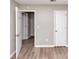 Bright bedroom featuring new floors and access to the closet and the rest of the house at 5290 Forest Downs Ln, Atlanta, GA 30349