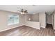 Cozy living room with hardwood flooring, ceiling fan and neutral paint at 5290 Forest Downs Ln, Atlanta, GA 30349